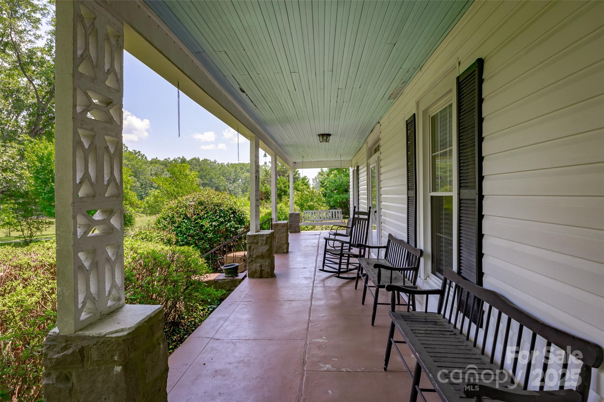 274 Old Harden Road Winnsboro, SC 29180 - Photo 28 of 39 a view of a patio with chairs and potted plants