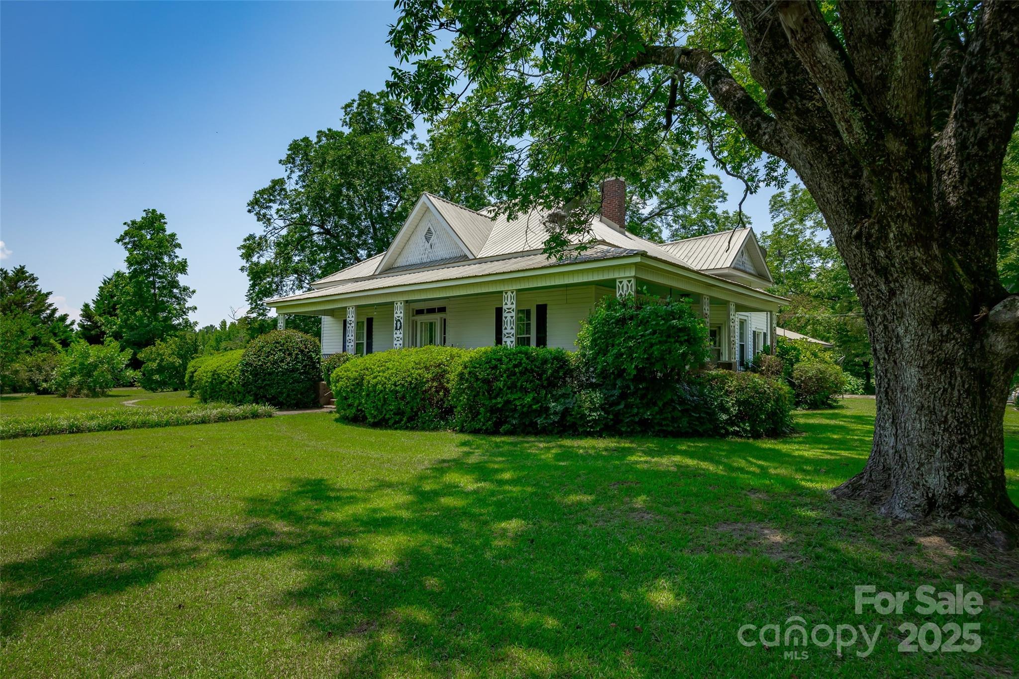 274 Old Harden Road Winnsboro, SC 29180 - Photo 3 of 39 a front view of a house with a garden