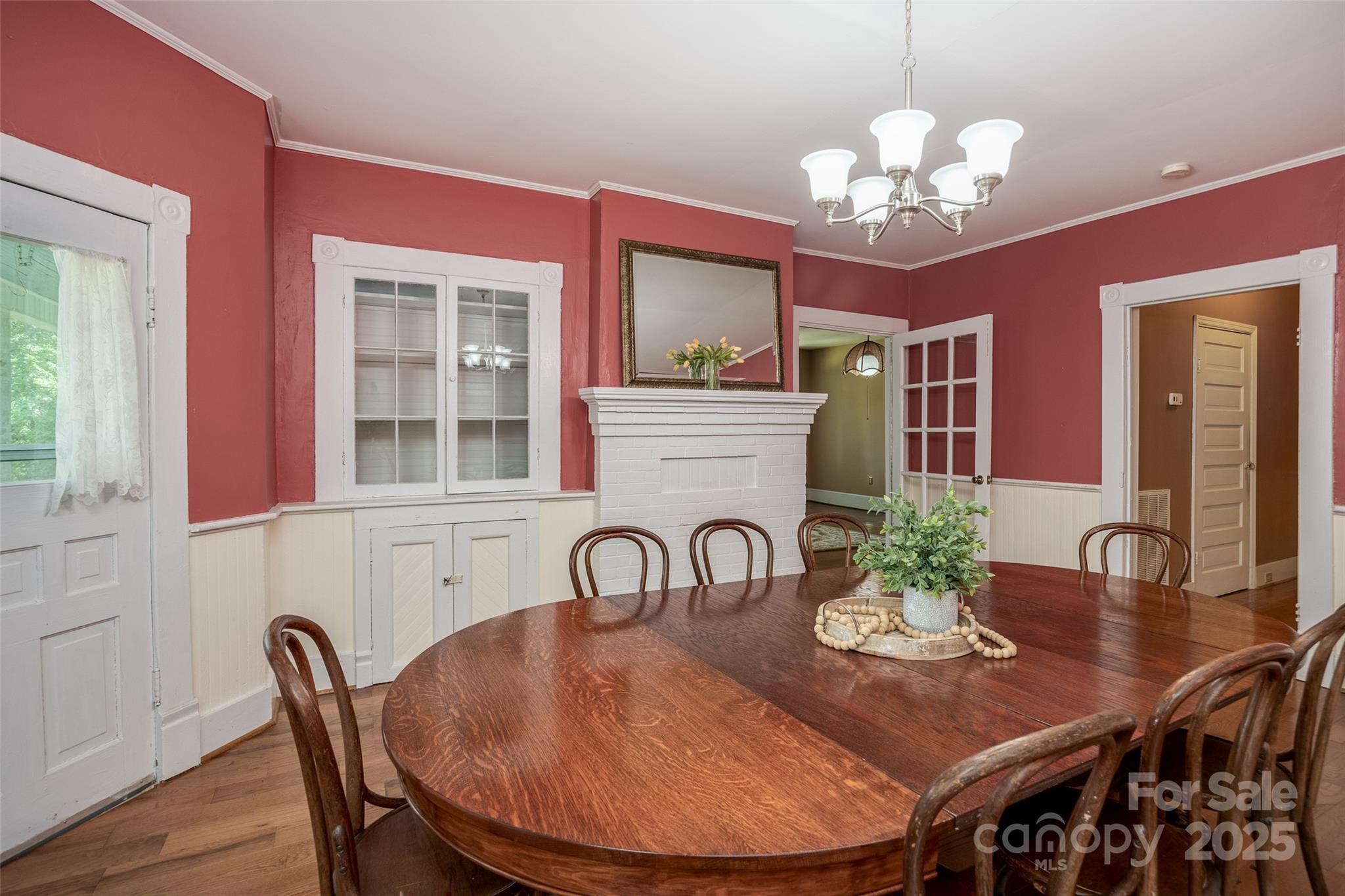 274 Old Harden Road Winnsboro, SC 29180 - Photo 9 of 39 a view of a dining room with furniture a chandelier and wooden floor