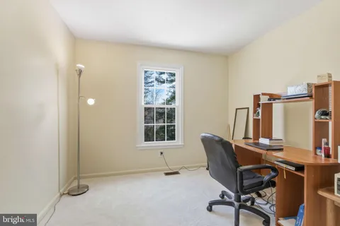 a workspace with furniture and a window