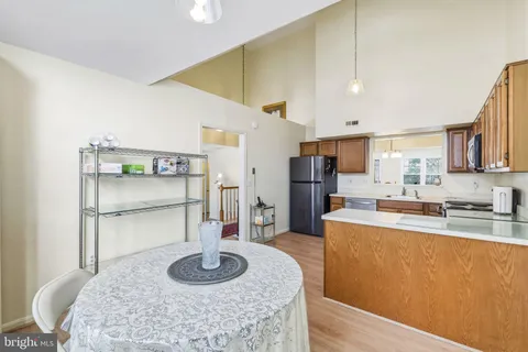 a kitchen with a table and chairs in it