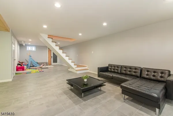 a living room with furniture and a couch