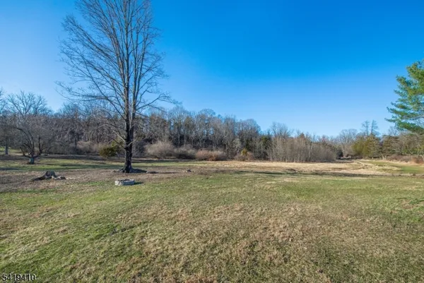 a view of outdoor space with deck and yard