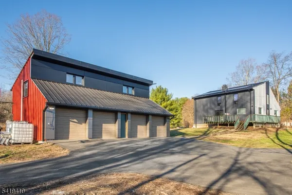 a front view of house with yard outdoor seating and green space