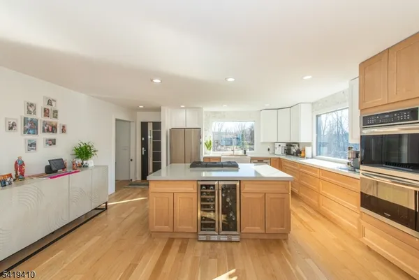 a kitchen with stainless steel appliances granite countertop a stove and a refrigerator