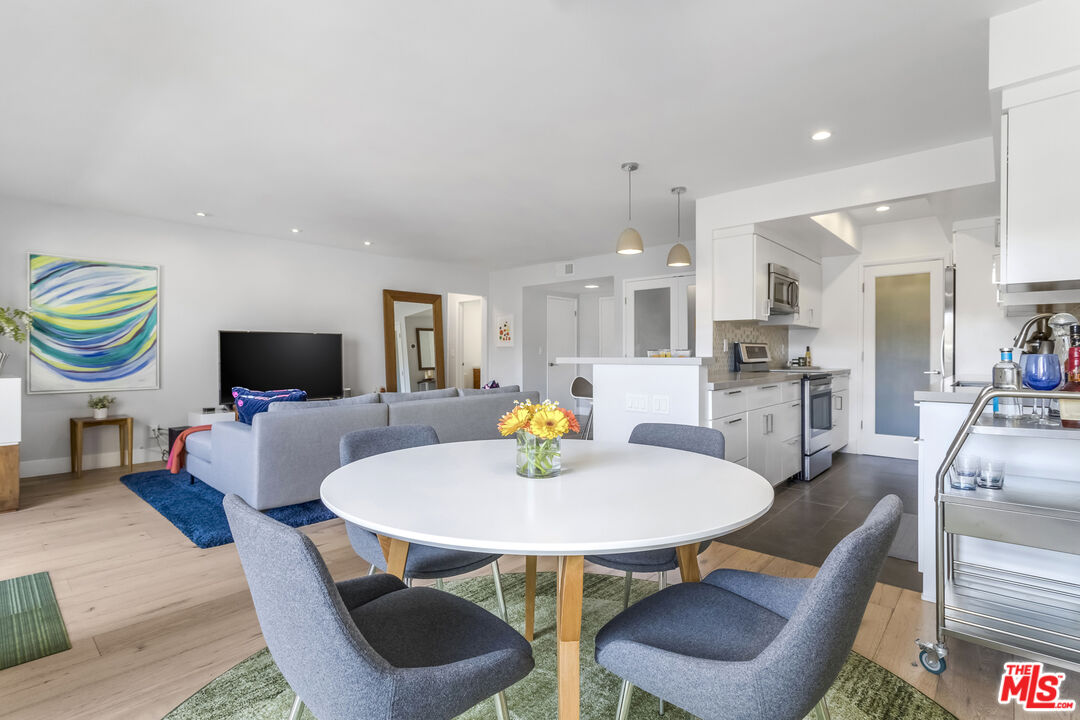 1221 North Kings Road, Unit 208 West Hollywood, CA 90069 - Photo 5 of 25 a view of a dining room with furniture