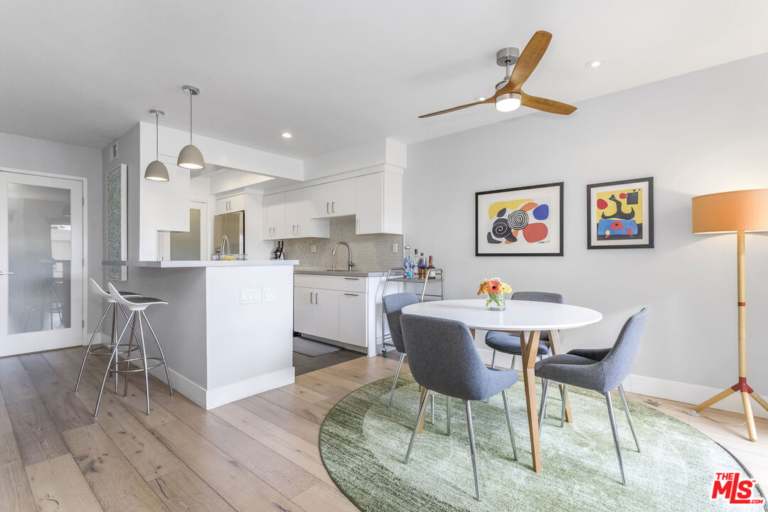 1221 North Kings Road, Unit 208 West Hollywood, CA 90069 - Photo 6 of 25 a living room with furniture and kitchen view