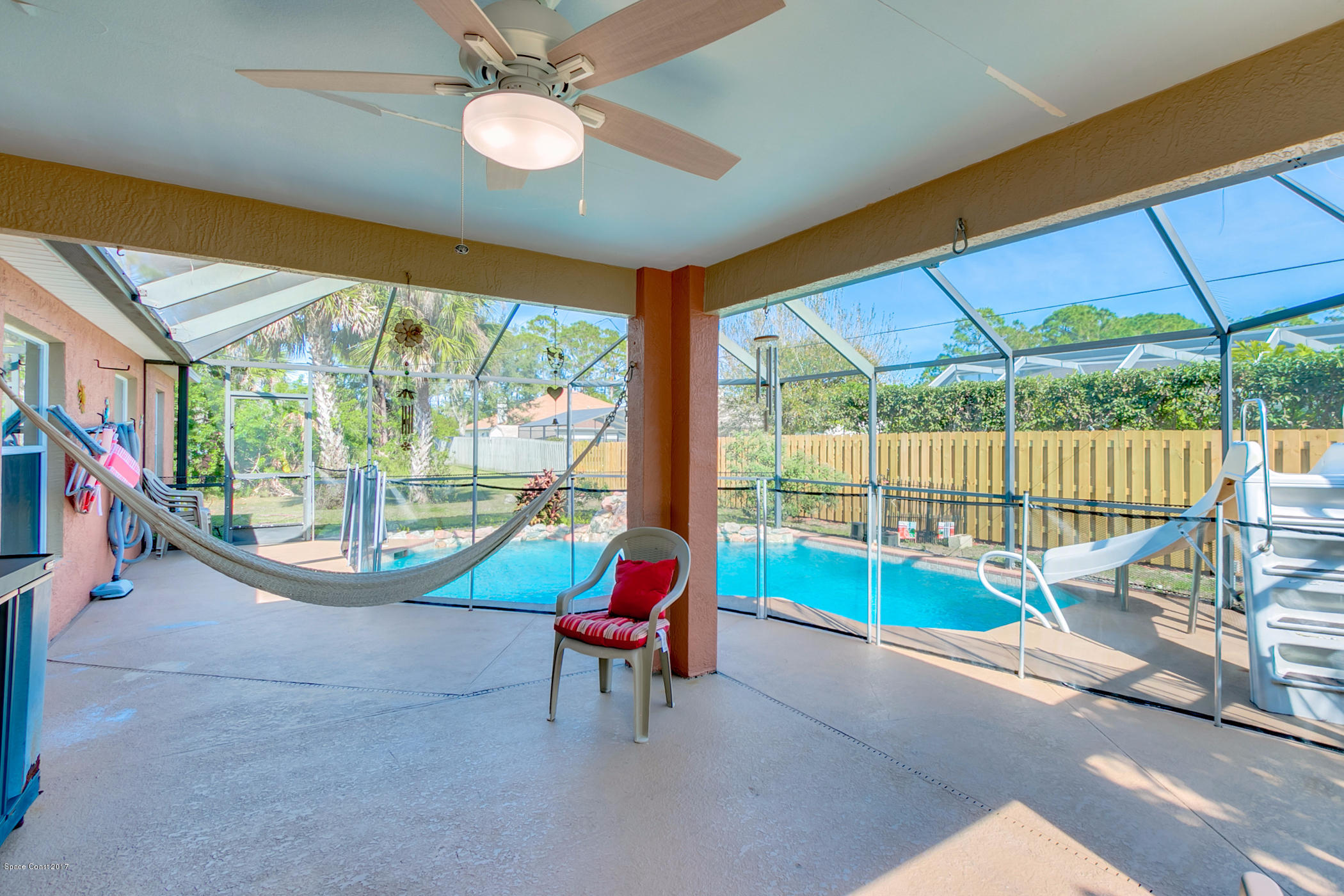 129 Donna Road Palm Bay, FL 32907 - Photo 25 of 36 Pool Area with Baby Gate
