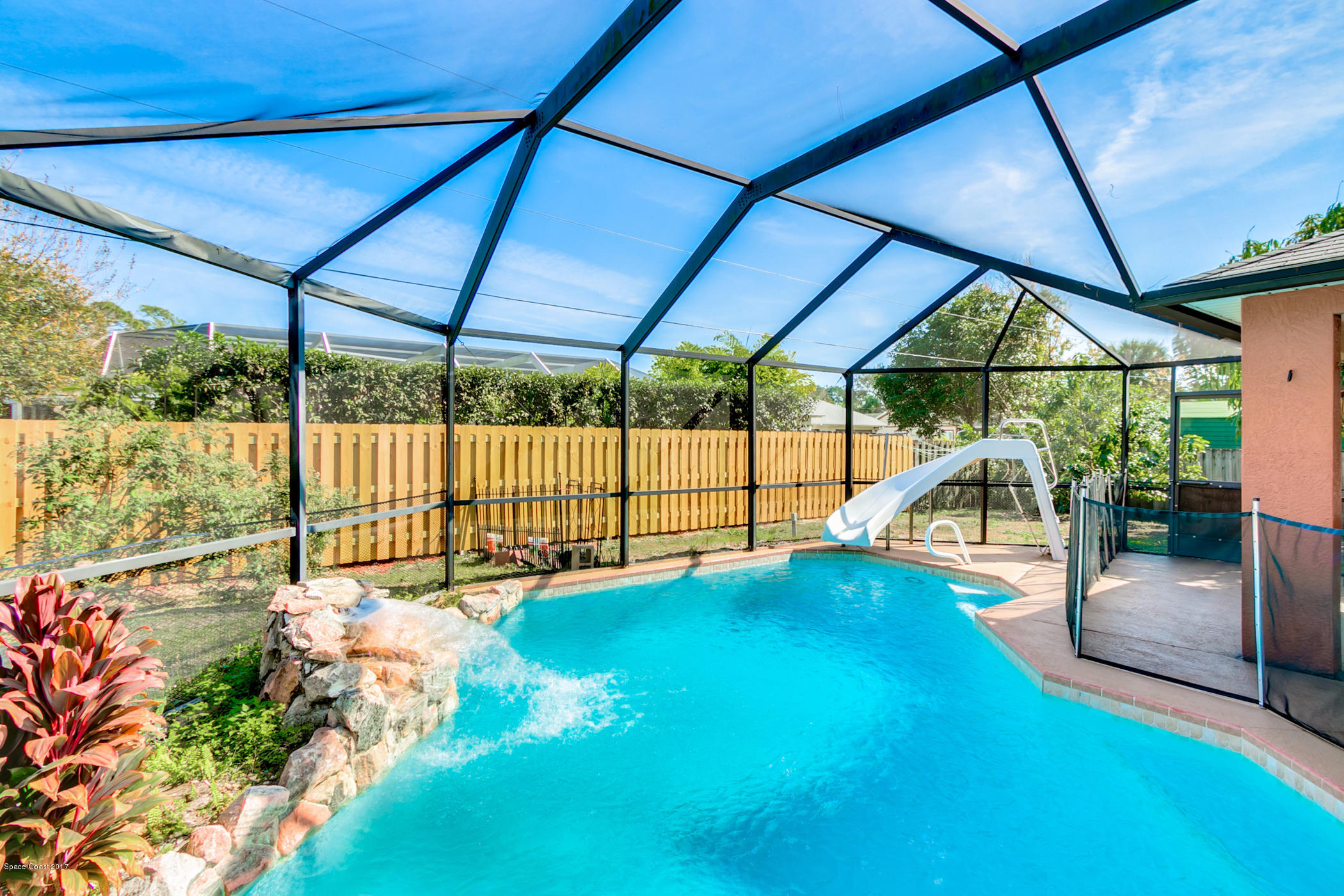 129 Donna Road Palm Bay, FL 32907 - Photo 29 of 36 Screened Pool with Privacy Fence