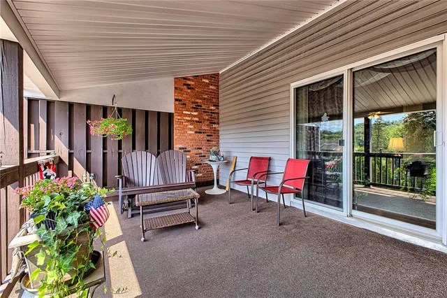 a view of a two chairs in the balcony