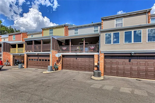 a front view of a house with a garage
