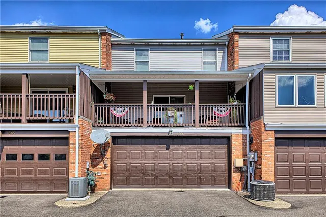 a front view of a house with a garage