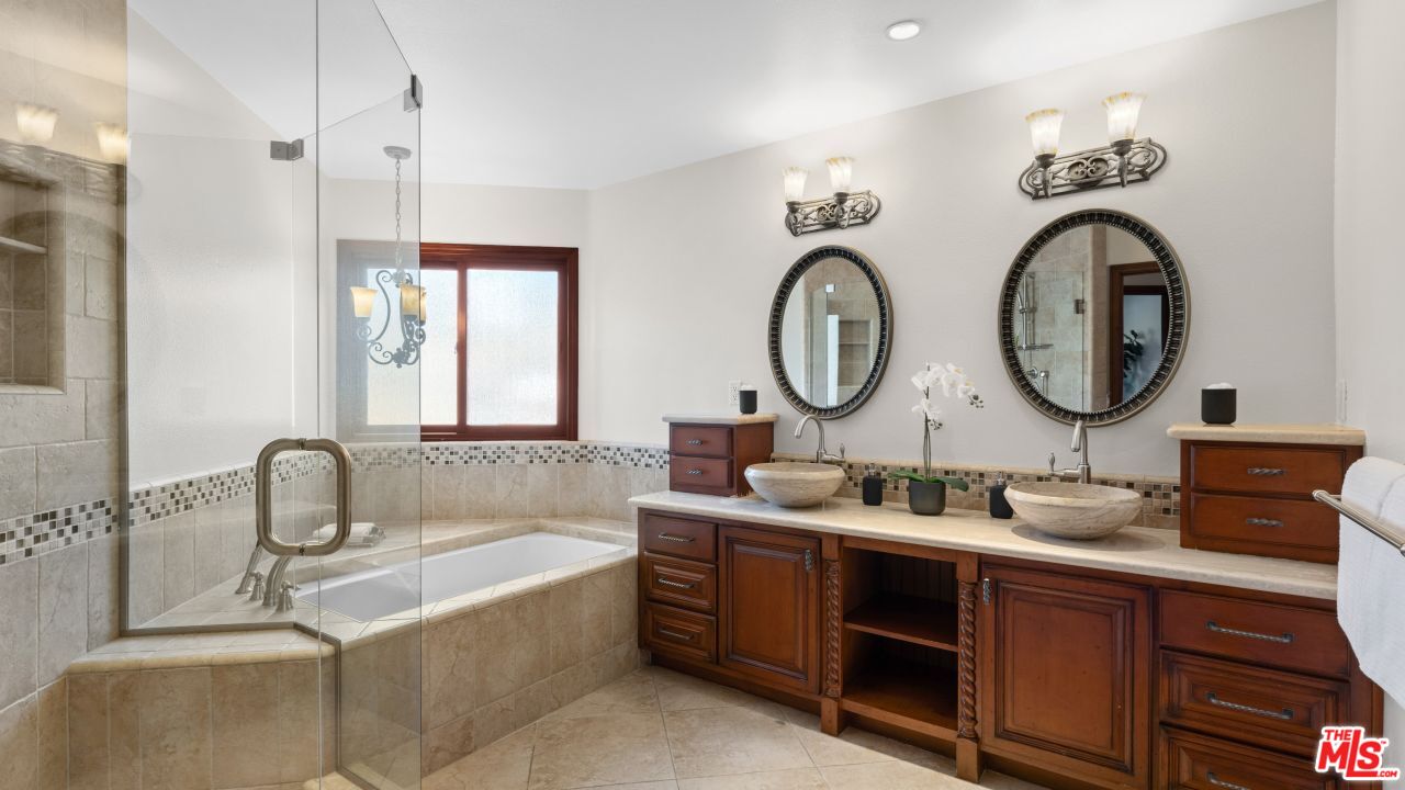 4117 Vanetta Place Studio City, CA 91604 - Photo 14 of 21 a bathroom with a double vanity sink and a mirror
