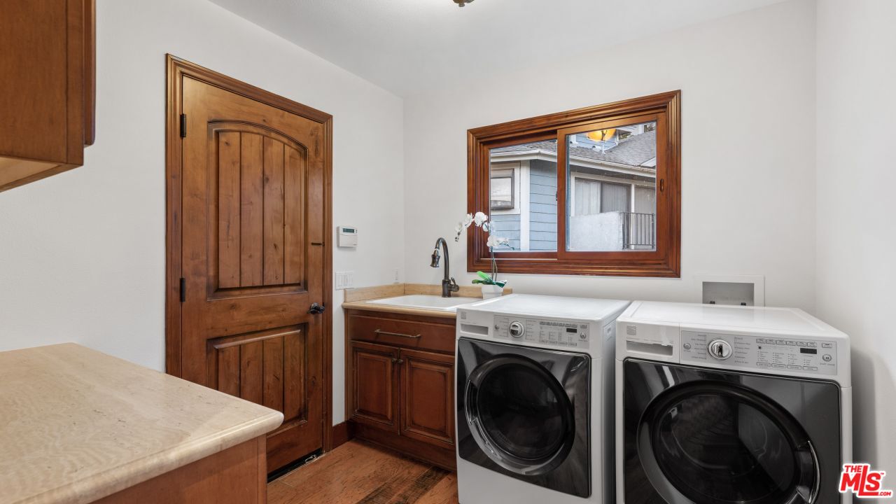 4117 Vanetta Place Studio City, CA 91604 - Photo 15 of 21 a view of a storage and utility room with washer and dryer