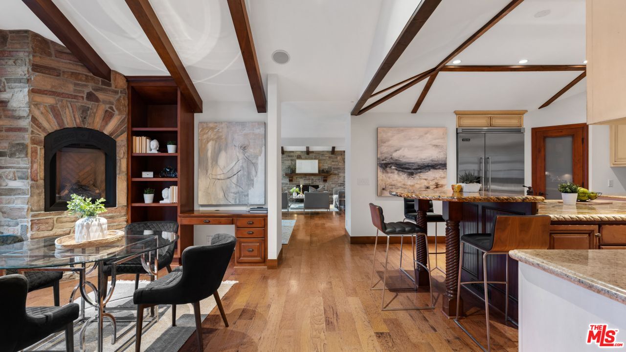 4117 Vanetta Place Studio City, CA 91604 - Photo 4 of 21 a living room with fireplace furniture and wooden floor
