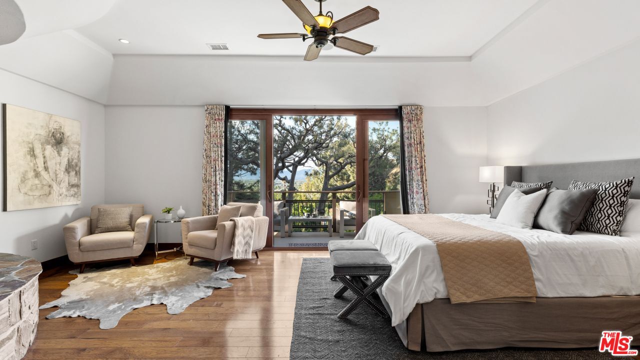 4117 Vanetta Place Studio City, CA 91604 - Photo 8 of 21 a bedroom with a bed and glass window