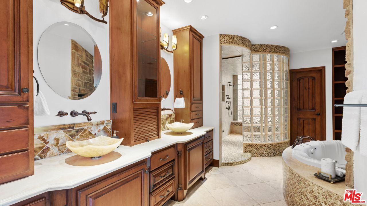 4117 Vanetta Place Studio City, CA 91604 - Photo 10 of 21 a spacious bathroom with a granite countertop double vanity sink mirror and