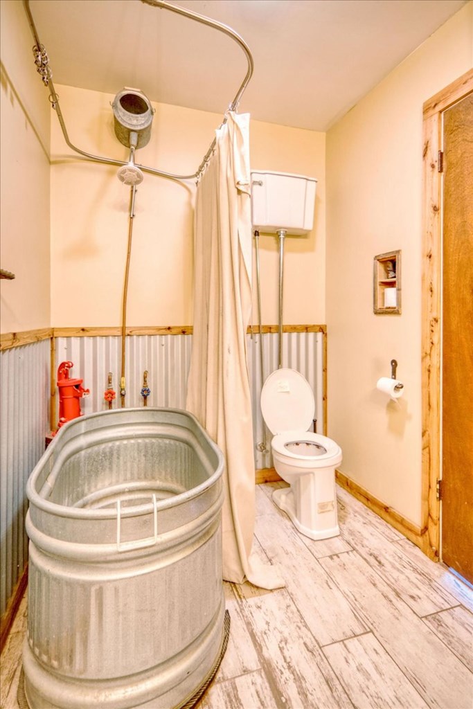 710 Elm Street Mason, TX 76856 - Photo 15 of 16 a white bath tub sitting next to a white toilet