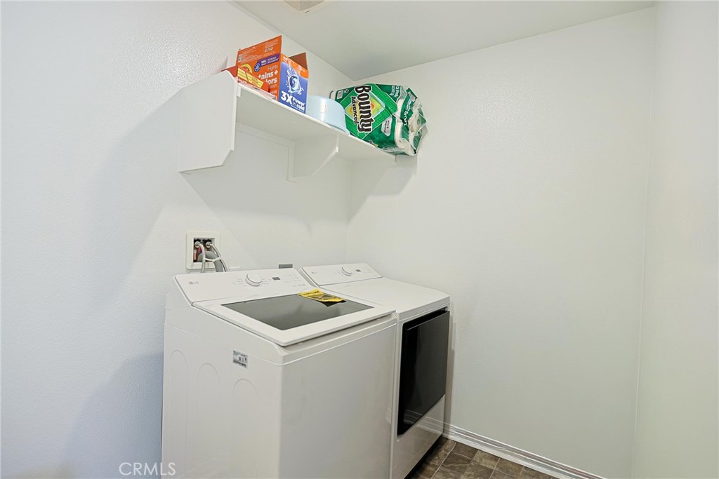 7486 Olive Grv Street Riverside, CA 92507 - Photo 41 of 57 a utility room with dryer and washer