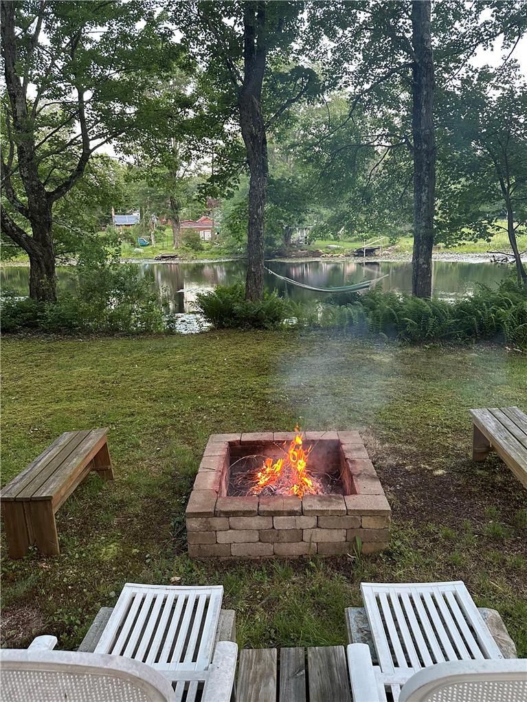10 Kizer Pond Road Lake Ariel, PA 18436 - Photo 36 of 48 A lakeside sanctuary offers a crackling fire pit and a serene view of the water.