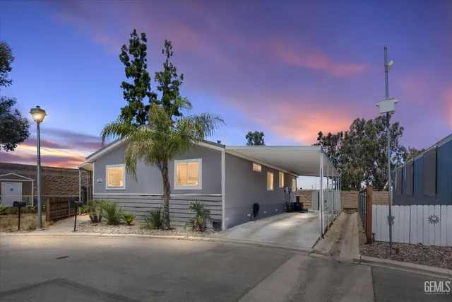 a view of a house with a yard and garage