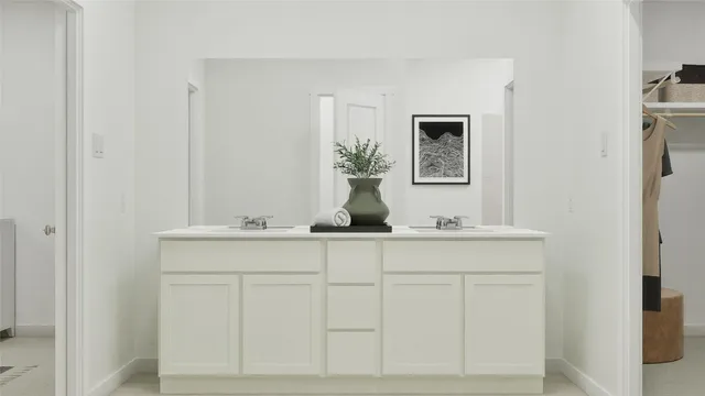 a bathroom with a sink and mirror