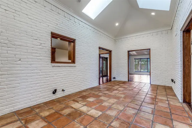 a view of a house with a backyard and balcony