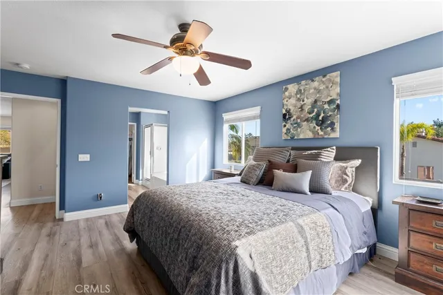 a bedroom with double bed and a chandelier