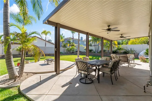 a dining room with furniture and garden view