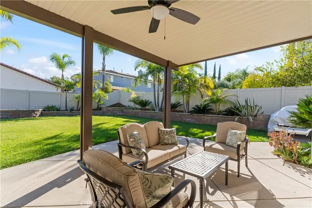 a balcony with furniture and garden view
