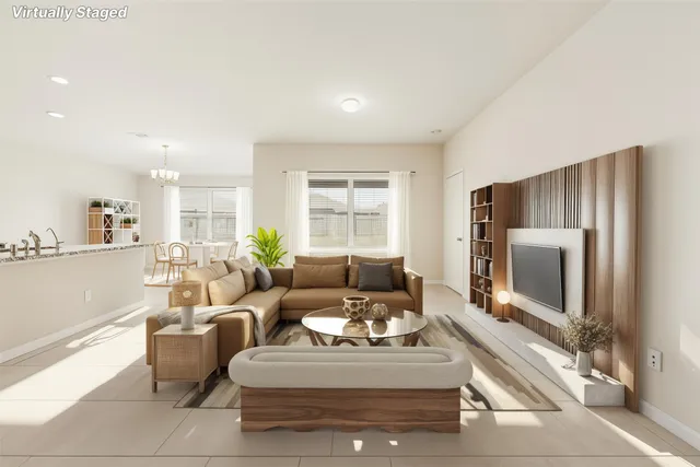 a living room with furniture a large window and a flat screen tv