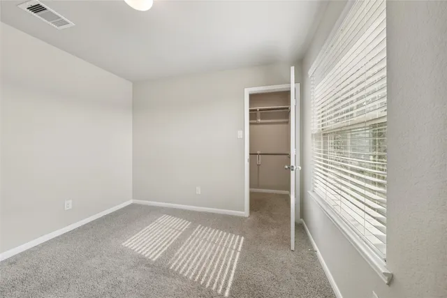 a view of livingroom with hardwood floor and cabinet