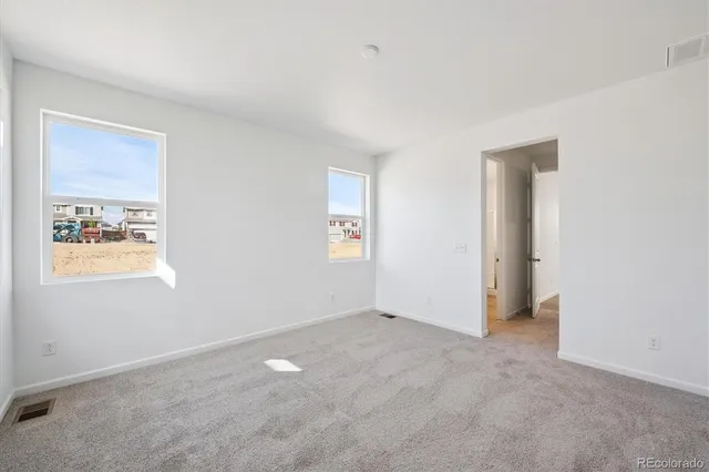 an empty room with windows