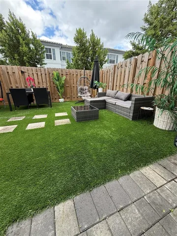 a garden view with a seating space