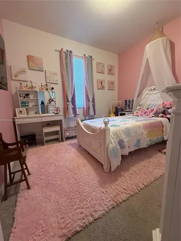 a bedroom with a bed and a cabinets
