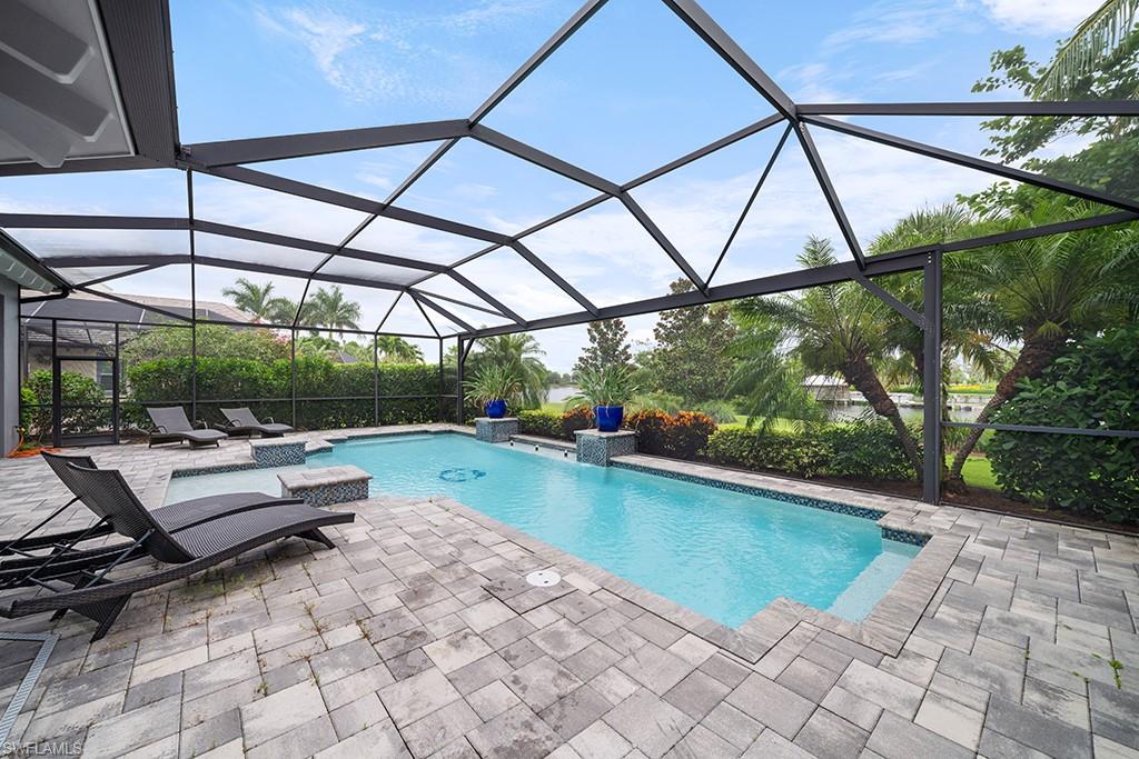 5154 Andros Drive Naples, FL 34113 - Photo 5 of 46 a view of swimming pool with a patio
