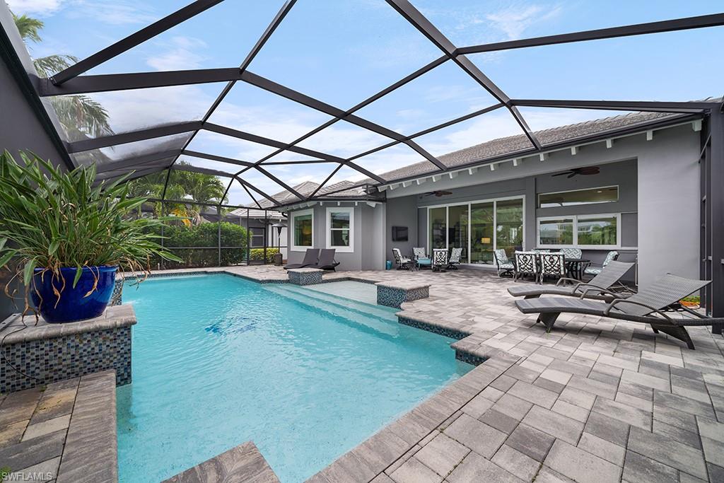 5154 Andros Drive Naples, FL 34113 - Photo 7 of 46 a view of swimming pool with outdoor seating