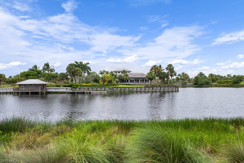 5154 Andros Drive Naples, FL 34113 - Photo 10 of 46 a view of a lake with a house