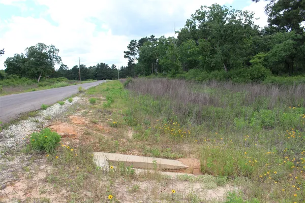 a view of a lake view with a wooden fence