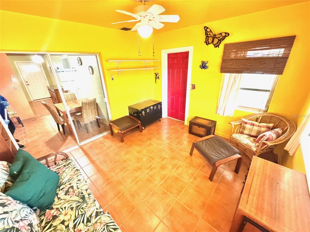 1035 Robmar Road Dunedin, FL 34698 - Photo 13 of 40 a outdoor room with chairs