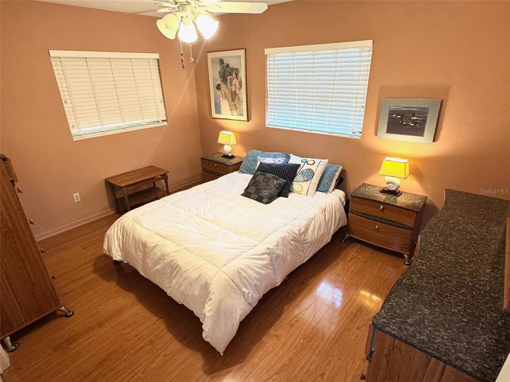 1035 Robmar Road Dunedin, FL 34698 - Photo 15 of 40 a bedroom with bed and window