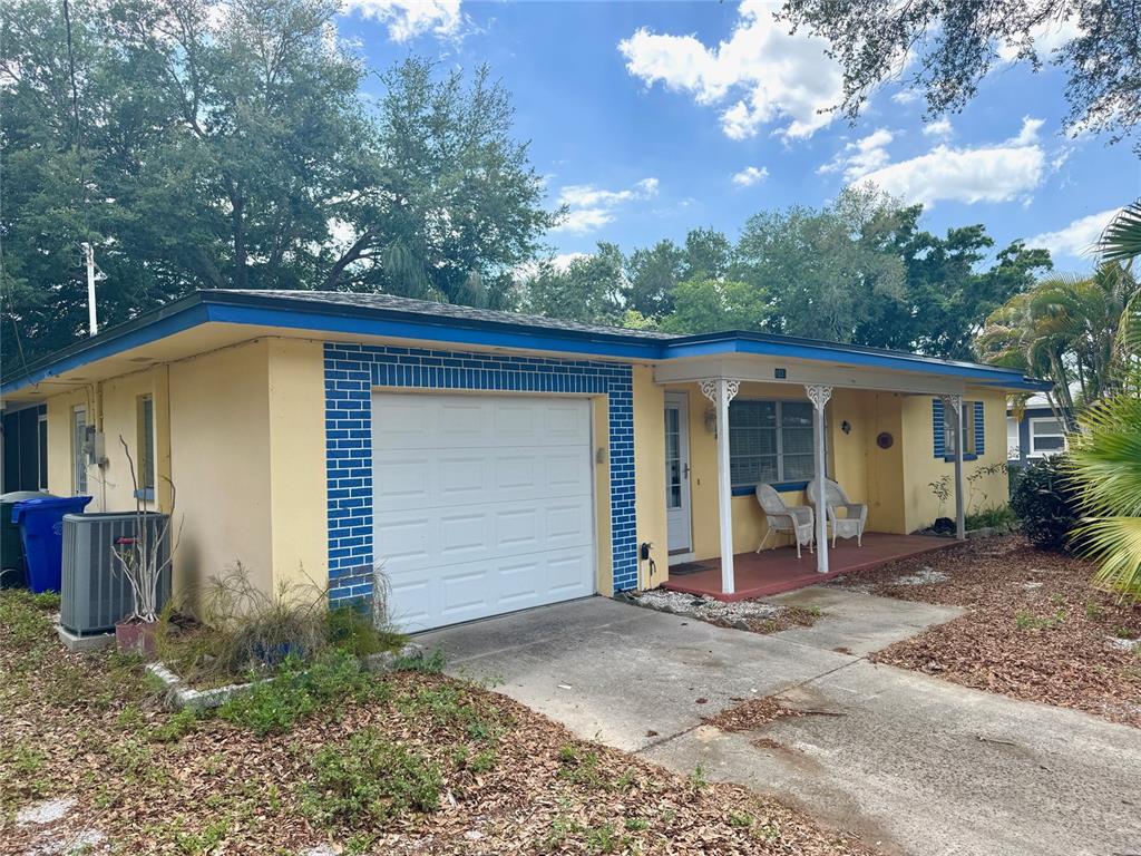 1035 Robmar Road Dunedin, FL 34698 - Photo 2 of 40 a view of a house with backyard and porch