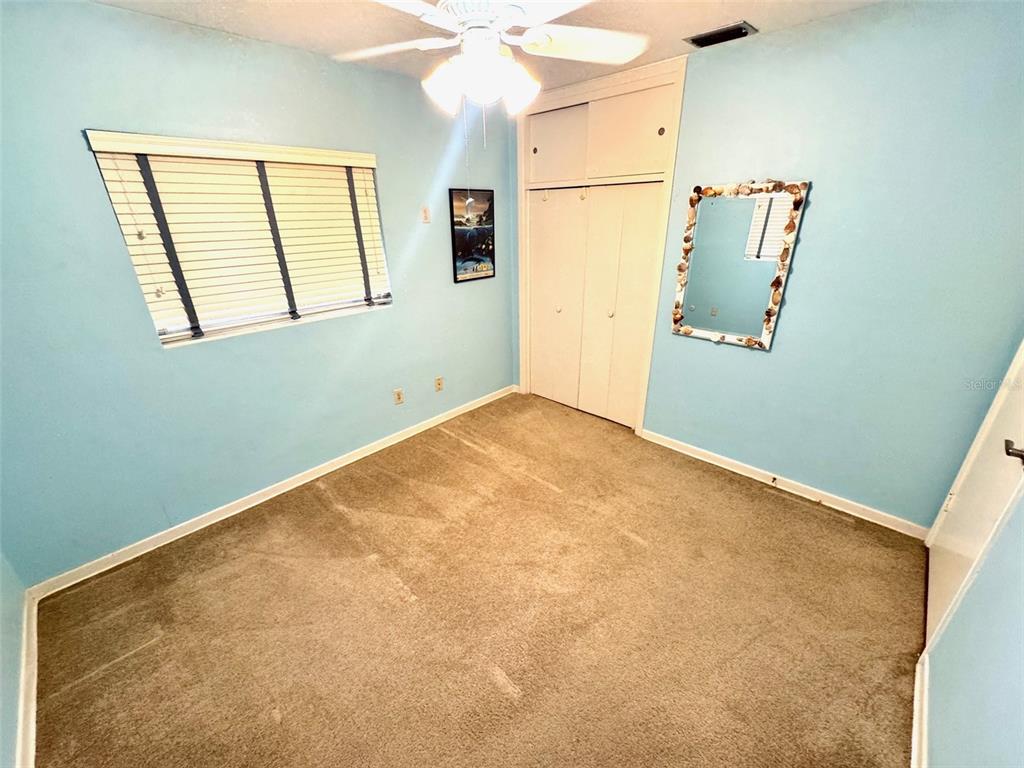 1035 Robmar Road Dunedin, FL 34698 - Photo 23 of 40 an empty room with windows