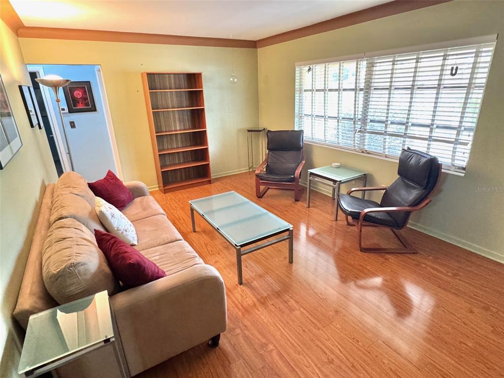 1035 Robmar Road Dunedin, FL 34698 - Photo 3 of 40 a living room with furniture and a window