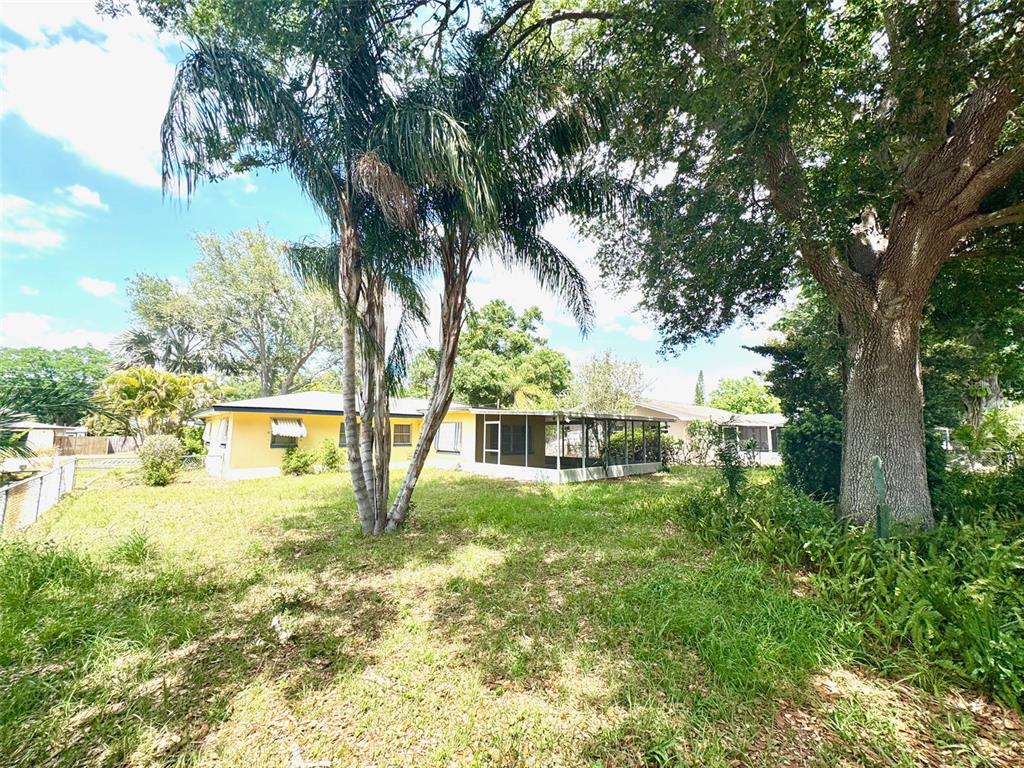 1035 Robmar Road Dunedin, FL 34698 - Photo 33 of 40 a view of an house with a yard