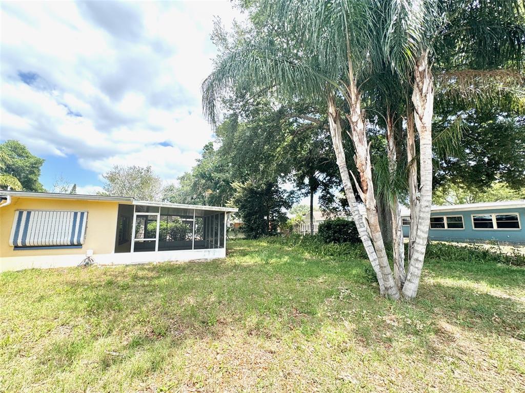 1035 Robmar Road Dunedin, FL 34698 - Photo 34 of 40 a view of a house with backyard and sitting area