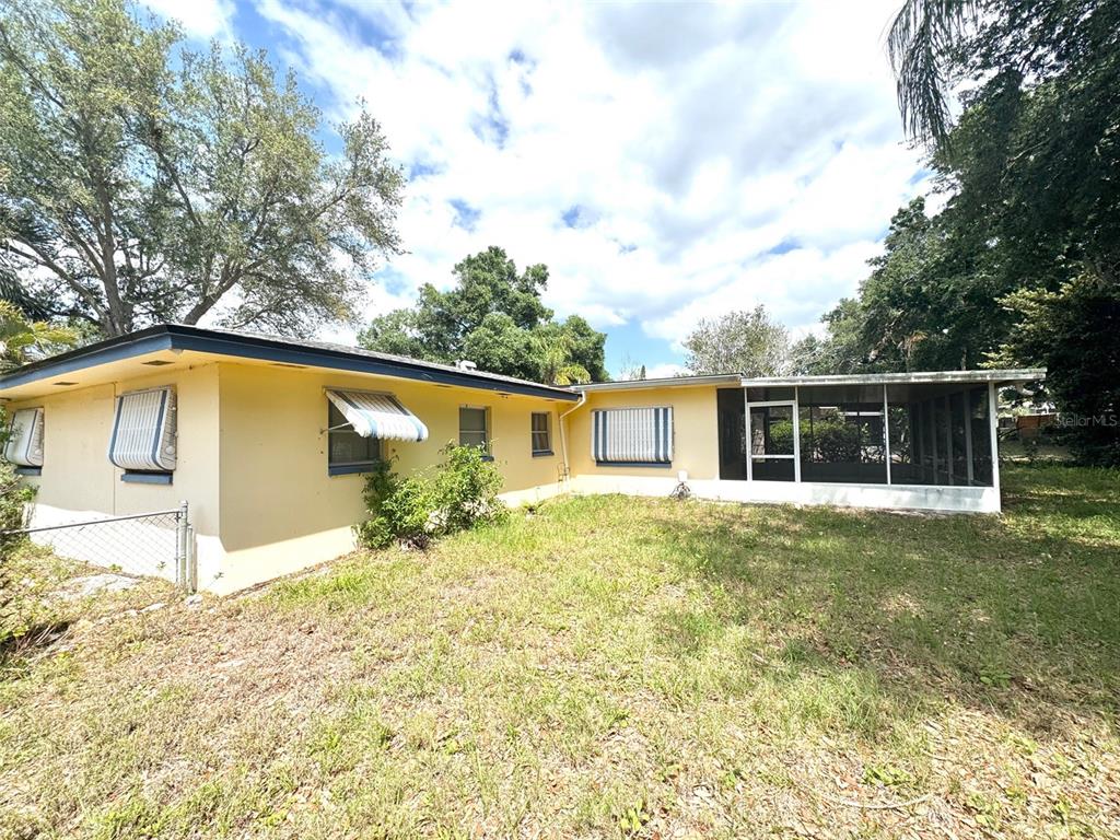 1035 Robmar Road Dunedin, FL 34698 - Photo 35 of 40 a front view of a house with a yard