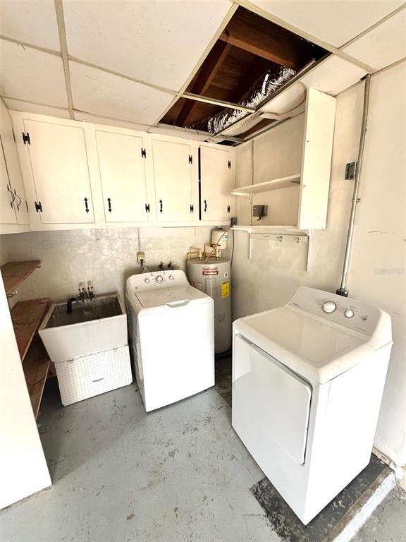 1035 Robmar Road Dunedin, FL 34698 - Photo 39 of 40 a utility room with dryer and washer