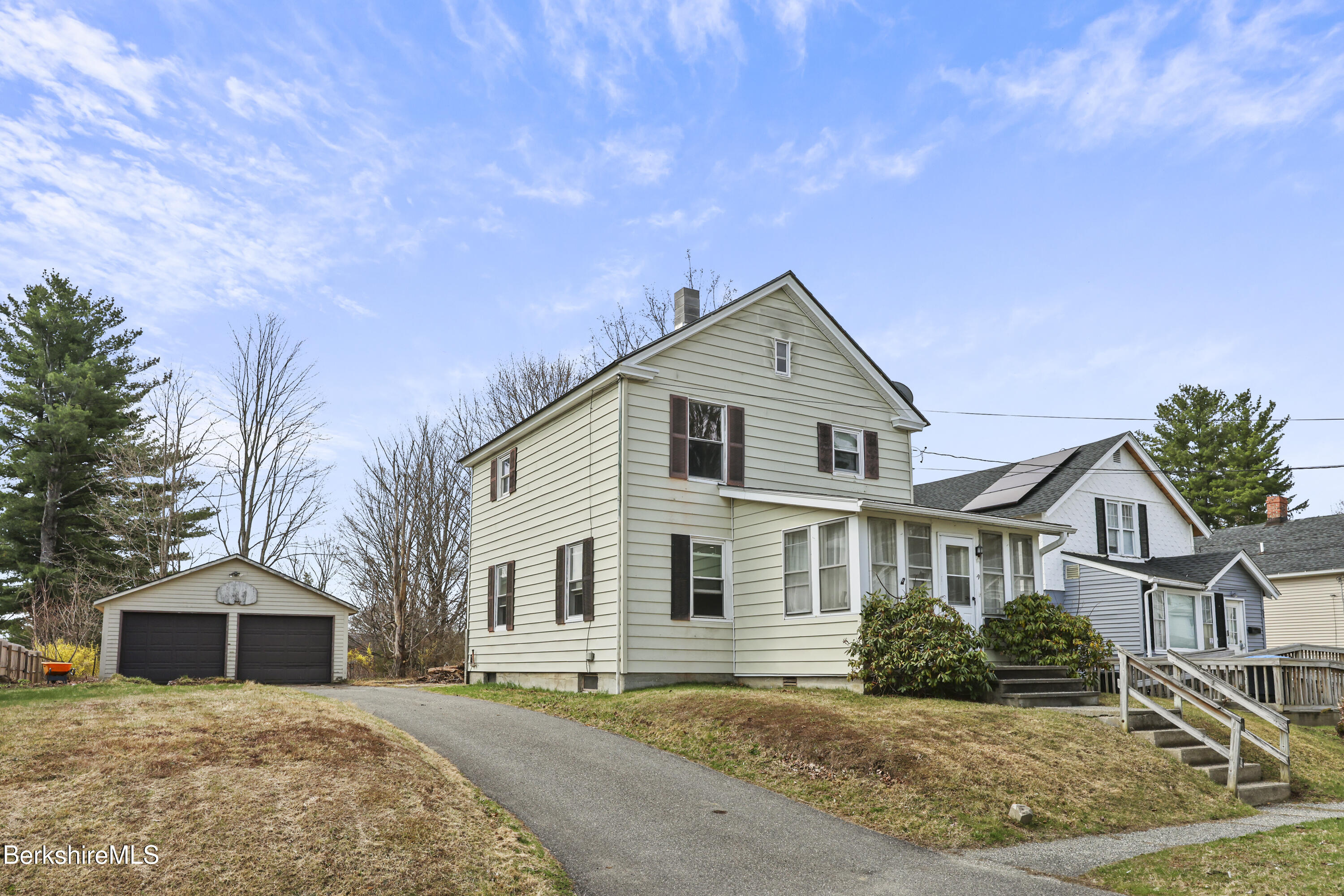 49 McArthur Street Pittsfield, MA 01201 - Photo 1 of 33 a front view of a house with a yard
