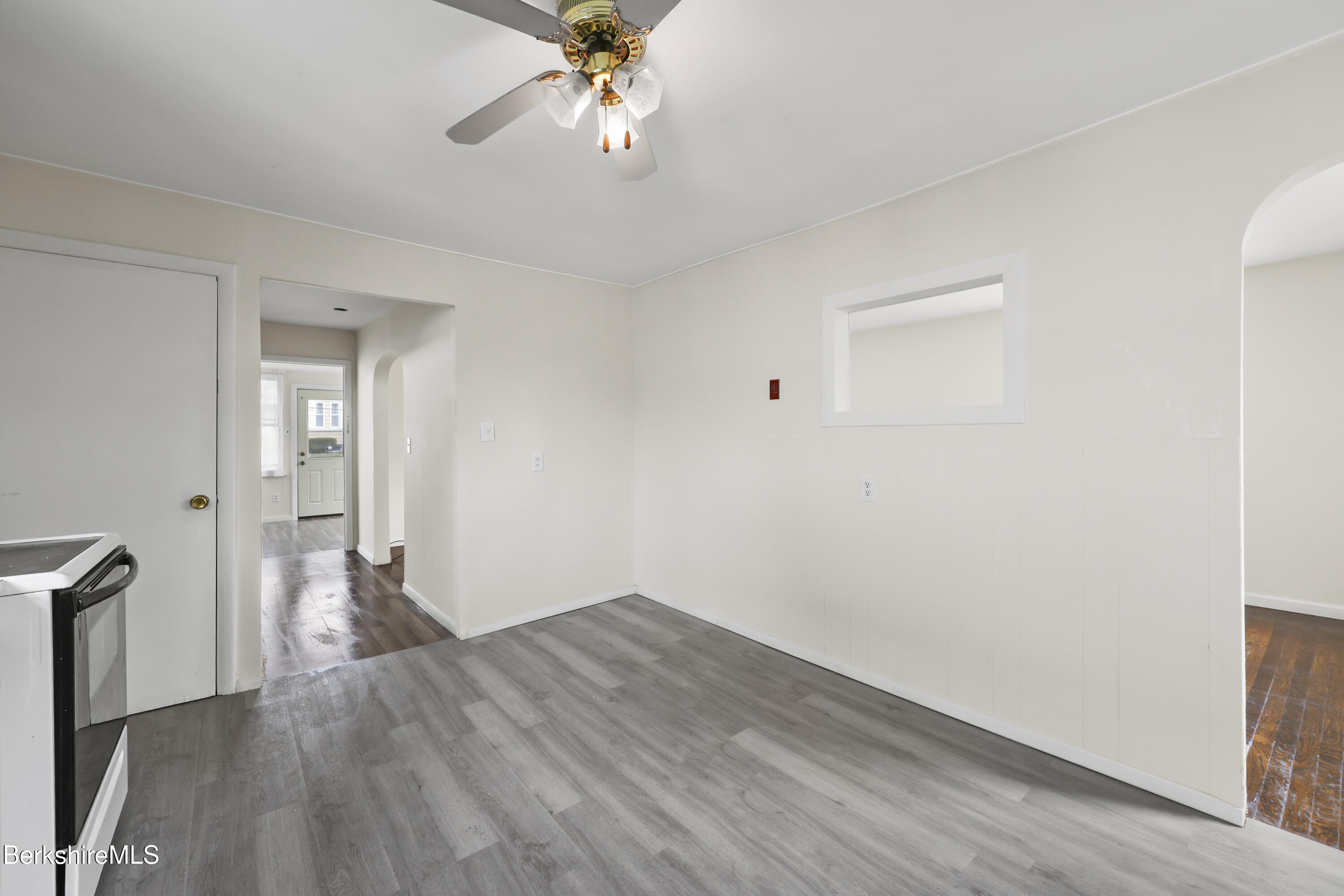 49 McArthur Street Pittsfield, MA 01201 - Photo 12 of 33 wooden floor in an empty room with a window